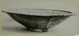 Bowl of Black-on-Red pottery, side view, with a wide flared rim and ring base.