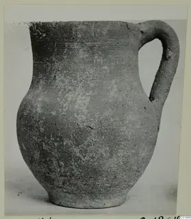 Pottery jug with a single loop handle, catalogued as Pottery Plain White VI