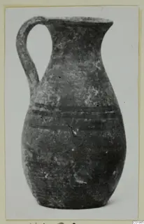 Pottery White Painted VI jug with a single loop handle and two dark bands around the body