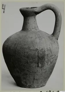 Pottery Plain White VI jug from Marion, with a single strap handle, photographed against a plain background
