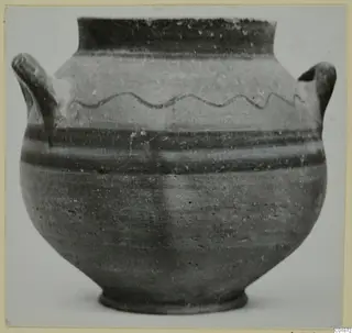 Pottery vessel from Marion with two handles and a wavy painted line on the shoulder, shown against a plain background