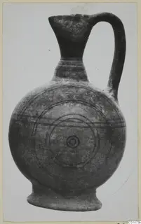 Pottery Black-on-Red III_V - V_VII jug with a single handle, decorated with concentric circles and horizontal bands