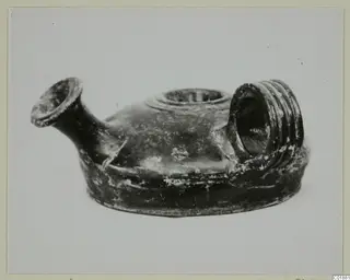 Black glazed guttus from Marion, side view showing spout, filling hole and ribbed handle