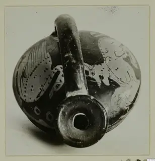 Red-figured pottery vessel with a tall handle and wide mouth, photographed from above at an angle