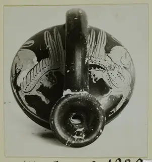 Squat painted vessel with a tall strap handle and ring foot, decorated with pale motifs on a dark ground