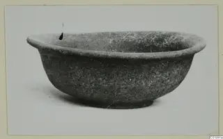 Bowl with a thick outturned rim and small ring base, photographed as a find from Marion