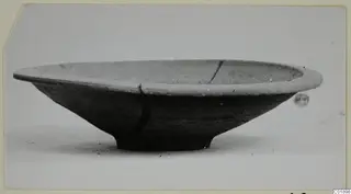 Pottery Plain White VII, a shallow bowl with a flat rim and small foot, seen from the side