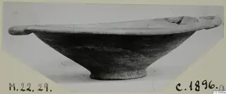 Pottery bowl with two small horizontal handles and a ring foot, from Marion, photographed on a mounted card