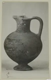 Pottery jug, White Painted I-II, from Lapithos Kastros tomb finds, with a loop handle and painted bands on the body.