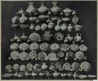 Group of pottery vessels from Idalion Tomb 3, jugs, bowls and round dishes arranged in tiered rows