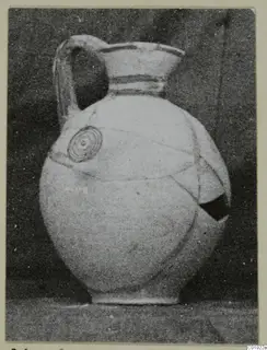 Pottery jug, White Painted III-1, with a strap handle and a concentric circle motif on the body