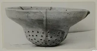 Plain White pottery bowl with a pierced lower body, from the Kastros tombs at Lapithos