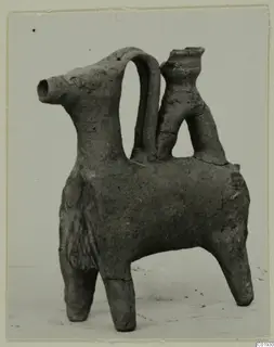 Clay vessel modelled as a four-legged animal, with a tubular spout at the head and a strap handle, from Lapithos