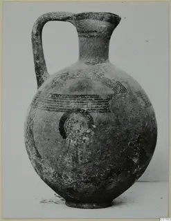 Round-bodied jug with a strap handle and dark painted bands, from the Kastros tombs at Lapithos