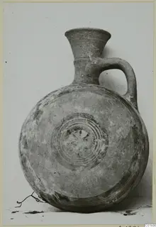 White Painted II juglet from Lapithos with a flared neck, loop handle and concentric rings on its body