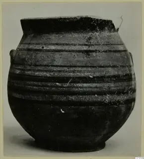 Globular pottery jar with a wide flat rim and dark horizontal painted bands on a light ground, with two small handles.
