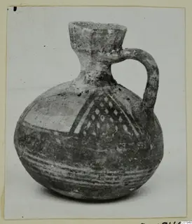 White Painted I jug from Lapithos, with a single loop handle, painted bands and a lozenge panel on the shoulder