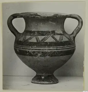 Two-handled pottery vessel with dark painted bands and a triangular pattern on the shoulder, shown in front view