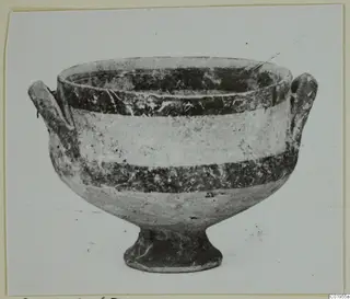 White Painted I bowl from Lapithos, shown from the side with two handles and a footed base
