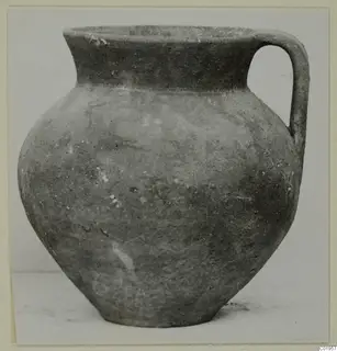 Pottery Coarse Ware jug with a single loop handle and a wide mouth, shown against a plain background