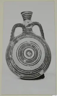 Pottery Bichrome II flask with a flattened round body, concentric painted rings, two loop handles and a banded neck