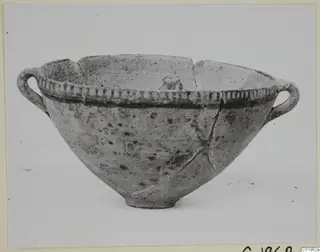 White Painted I bowl with two loop handles and a dark painted band below the rim