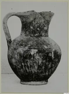 Black Slip Ware jug with a looped handle and vertically grooved body, from Lapithos, Kastros tombs