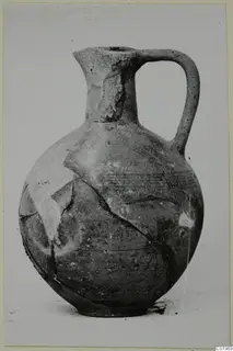 Jug with a pinched spout and a single loop handle, from the Kastros tombs at Lapithos
