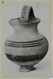 White Painted I jug from Lapithos with a broad strap handle and dark painted bands on the body