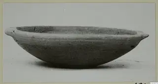 Plain White I-III bowl with two small handles on the rim, shown in side view