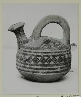 White Painted I jug with a spout and strap handle, decorated with painted bands and a lattice pattern
