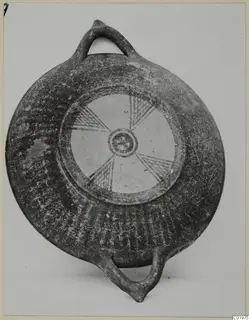 Black Slip Painted bowl with two loop handles and a radiating hatched pattern on its central disc, from Lapithos.