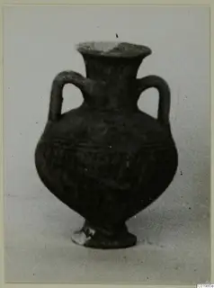 Black Slip Ware two-handled vessel from Lapithos, Kastros tombs, shown against a plain background