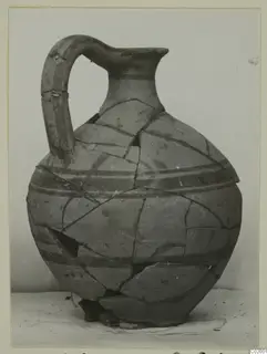 White Painted VI jug, a reconstructed pottery vessel with a strap handle and dark painted bands