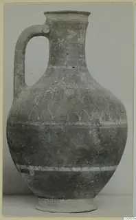 Pottery jug with a loop handle, white painted bands and floral motifs on the neck and shoulder, from Vouni