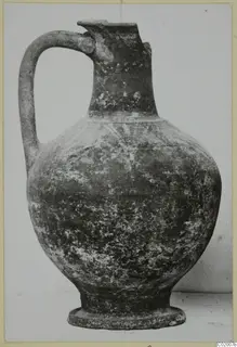 Jug with a strap handle, pinched spout and ring base, from the Bichrome-Red pottery series