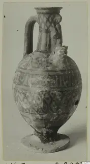 Pottery vessel White Painted VI from Vouni, with a strap handle and painted band and lattice decoration