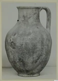 Pottery Plain White VII, a jug with a tall neck and single loop handle, shown against a plain backdrop