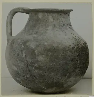 Coarse ware jug with a single loop handle, rounded body and flaring rim, from Vouni