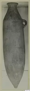Pottery Plain White VII vessel with a long pointed base and a single loop handle on the shoulder.