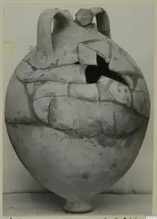 Pottery Plain White VI, a large round vessel with two loop handles, cracked and partly restored.