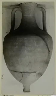 Pottery Plain White VII amphora with two handles, a narrow stem base and cracks across the body