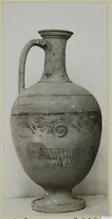 Pottery White Painted VII, a single-handled jug with painted bands and spiral motifs, from the Korakas tombs at Vouni