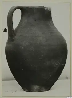 Coarse Ware jug from Vouni with a single loop handle, photographed against a plain background