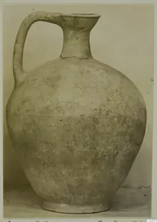 Pottery Plain White VI jug with a single strap handle and a flaring spout.