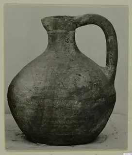 Jug of Pottery Plain White VI with a single loop handle, photographed against a plain grey backdrop