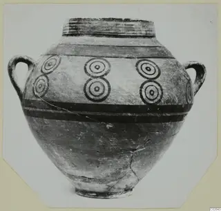 Two-handled jar from Marion with dark painted bands and rows of concentric circles