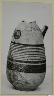 Pottery Black-on-Red I-III, a jug with a broken neck and a short side spout