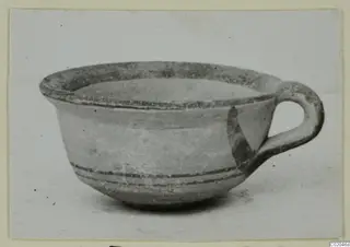 Pottery White Painted IV cup with a loop handle, from Marion