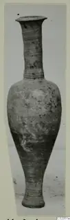 Pottery vessel with a tall narrow neck, flared rim and tapering base, from the Marion tombs